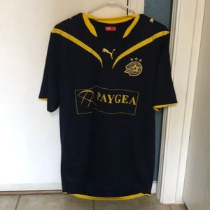 Men’s Puma soccer shirt.